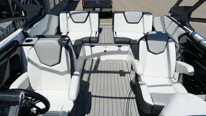 Slide: The Image of 2021 Yamaha Boats 252SD interior with white seating and modern design. - 13
