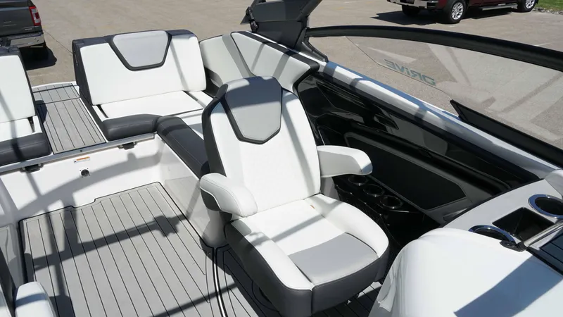 Slide: The Image of 2021 Yamaha Boats 252SD interior with sleek white and gray seating and modern design. - 15