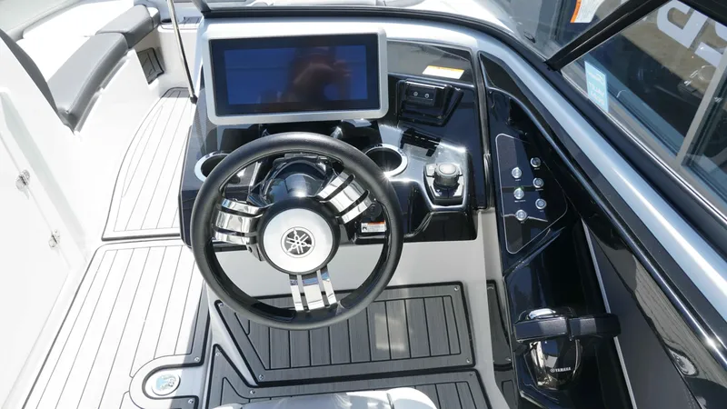 Slide: The Image of 2021 Yamaha Boats 252SD dashboard with steering wheel and touchscreen display. - 17
