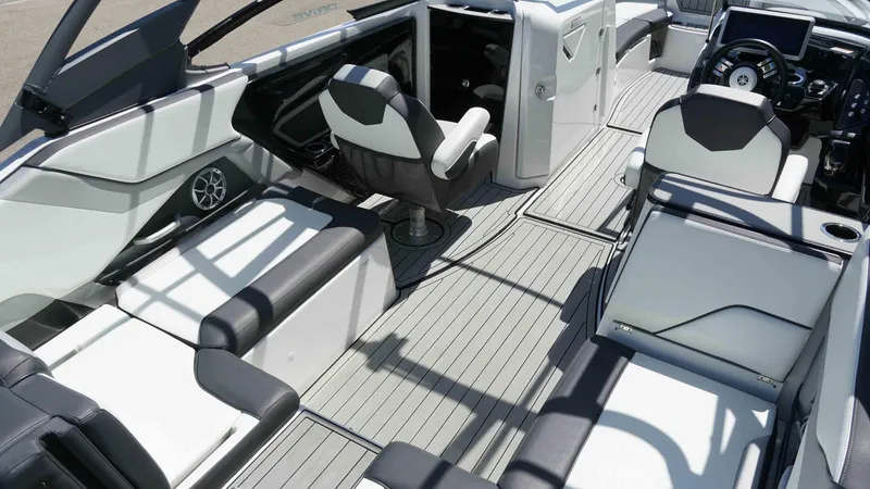 Slide: The Image of 2021 Yamaha Boats 252SD interior with sleek seating and modern dashboard design. - 7