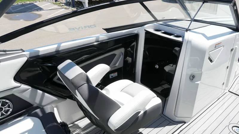 Slide: The Image of 2021 Yamaha Boats 252SD interior with sleek seating and modern dashboard design. - 8
