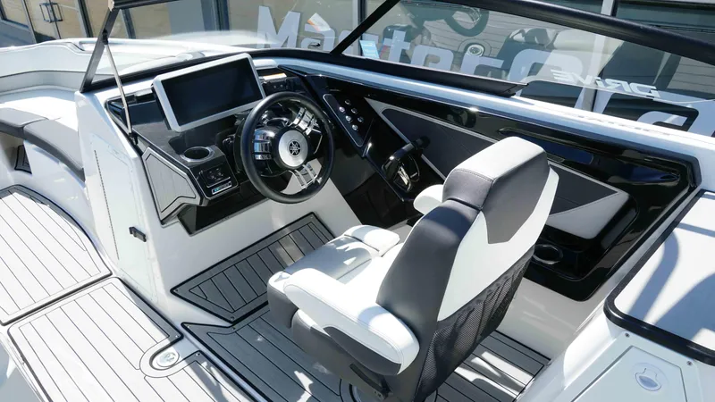 Slide: The Image of 2021 Yamaha Boats 252SD cockpit with modern steering and dashboard controls. - 9