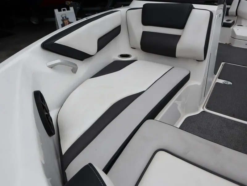 Slide: The Image of 2019 Yamaha Boats SX195 interior with black and white seating and speaker. - 12
