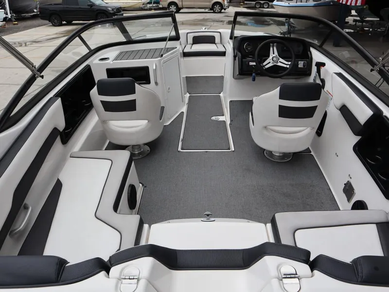 Slide: The Image of 2019 Yamaha Boats SX195 interior with seating and steering wheel, showcasing modern design. - 17