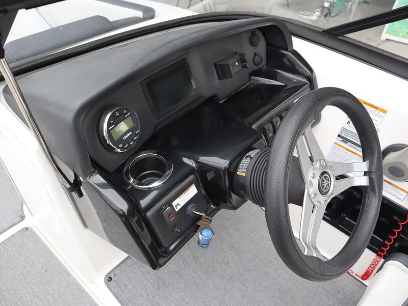 Slide: The Image of 2019 Yamaha Boats SX195 dashboard with steering wheel and controls. - 19