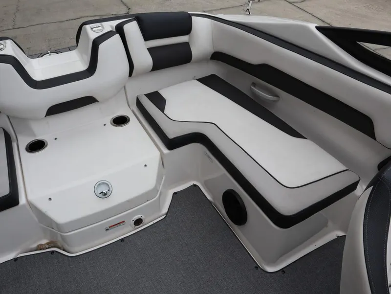Slide: The Image of 2019 Yamaha Boats SX195 interior seating with cup holders and sleek design. - 22