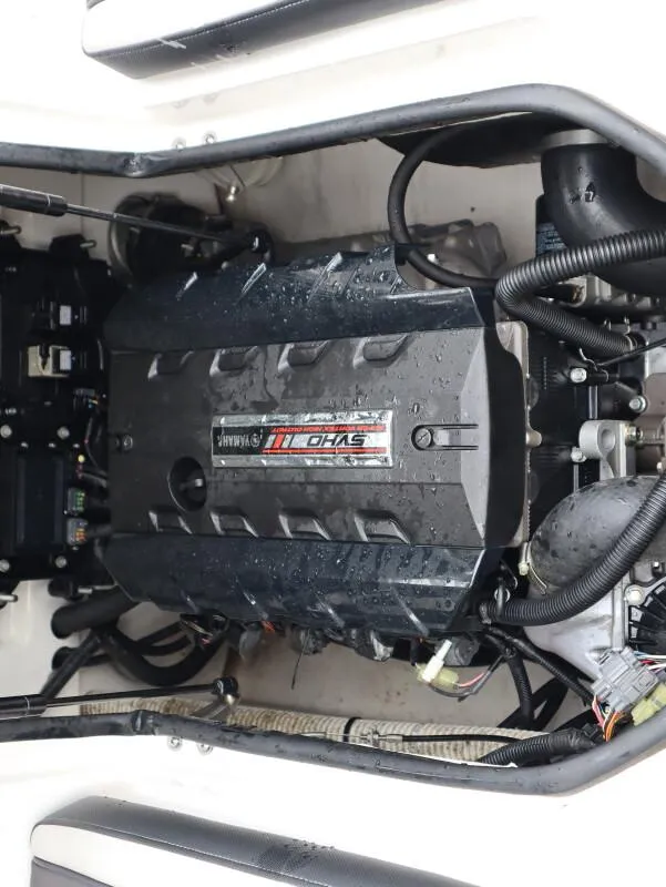 Slide: The Image of 2019 Yamaha Boats SX195 engine compartment with visible components and wiring. - 23