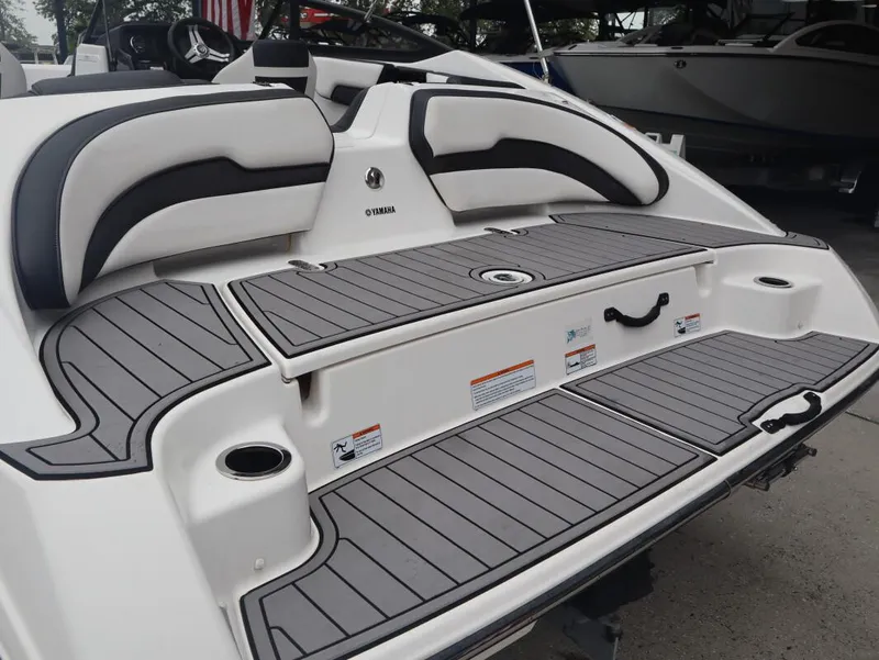 Slide: The Image of 2019 Yamaha Boats SX195 swim platform with cushioned seating and non-slip decking. - 5