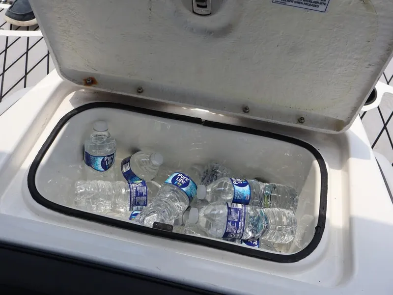 Slide: The Image of Cooler with bottled water on 2023 Bayliner Element M17 boat. - 19