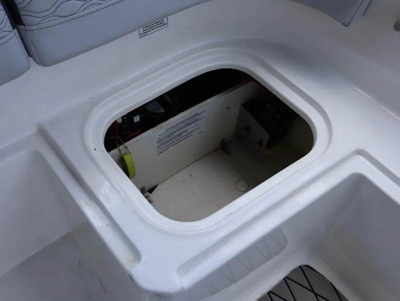 Slide: The Image of 2023 Bayliner Element M17 boat storage compartment with open hatch. - 20