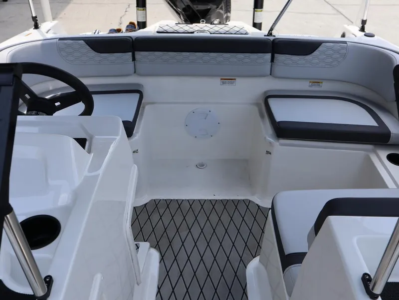 Slide: The Image of 2023 Bayliner Element M17 boat interior with seating and steering wheel. - 21
