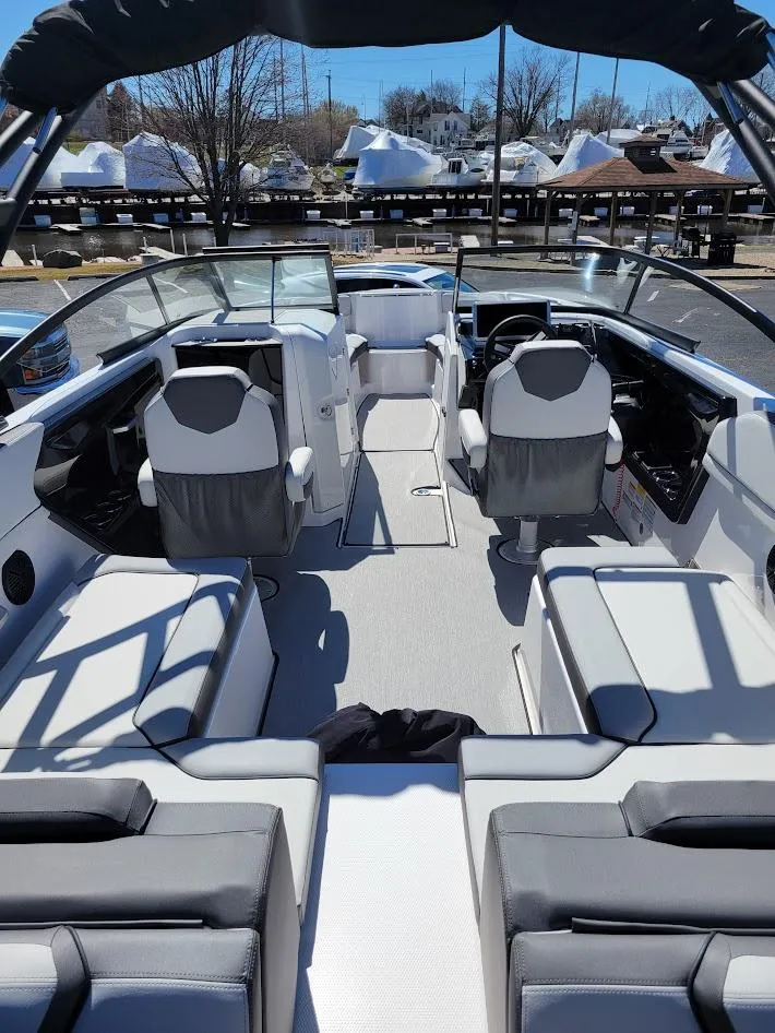 Slide: The Image of 2023 Yamaha Boats AR250 interior with modern seating and sleek design. - 7