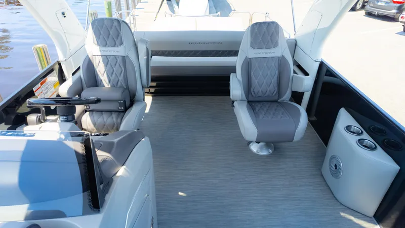Slide: The Image of 2022 Bennington 24 LXSBA boat interior with luxurious seating and modern design. - 14