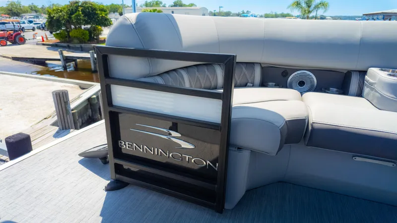 Slide: The Image of 2022 Bennington 24 LXSBA pontoon boat with luxurious seating and sleek design. - 24