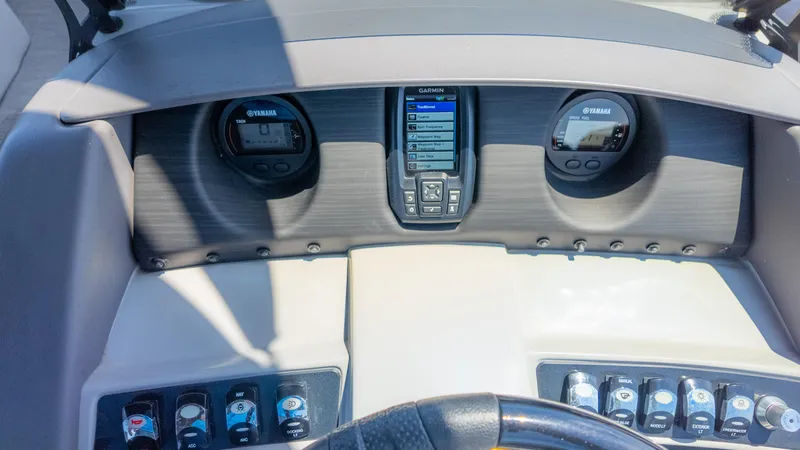 Slide: The Image of Dashboard of 2022 Bennington 24 LXSBA boat with Yamaha gauges and Garmin display. - 31