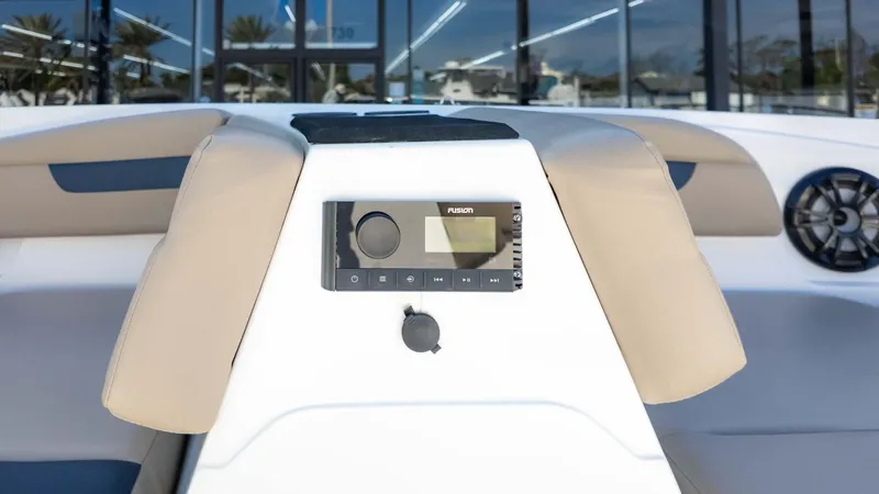 Slide: The Image of 2022 Hurricane SS185 boat interior with Fusion stereo system and beige seating. - 10