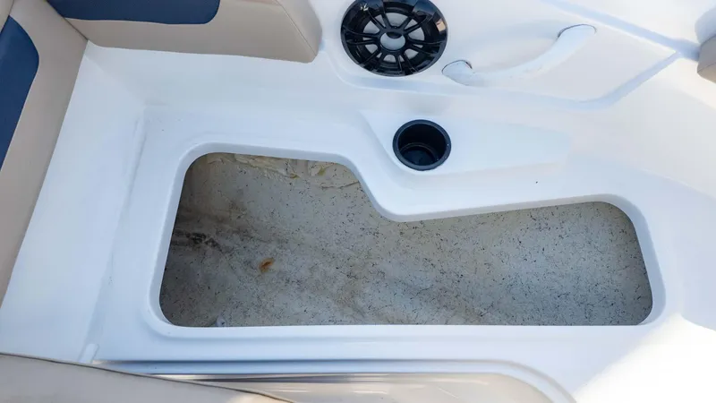 Slide: The Image of 2022 Hurricane SS185 boat interior with storage compartment and speaker. - 13