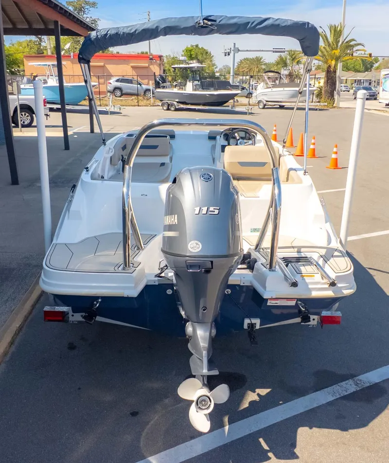 Slide: The Image of 2022 Hurricane SS185 boat with Yamaha 115 engine, parked outdoors. - 4