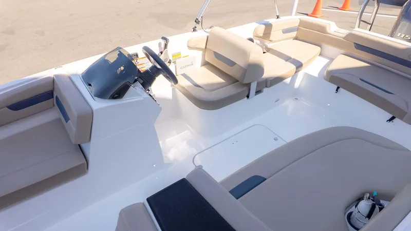 Slide: The Image of 2022 Hurricane SS185 boat interior with beige seating and steering console. - 6