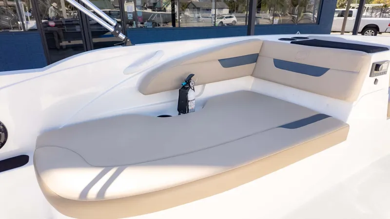 Slide: The Image of 2022 Hurricane SS185 boat interior with beige seating and a fire extinguisher. - 9