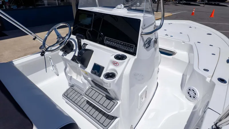 Slide: The Image of 2025 Tidewater 2110 Bay Max boat interior with steering console and modern controls. - 10