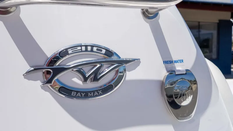 Slide: The Image of 2025 Tidewater 2110 Bay Max boat emblem and fresh water access. - 12