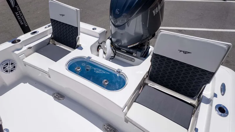 Slide: The Image of 2025 Tidewater 2110 Bay Max boat interior with seating and Yamaha engine. - 6