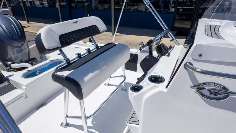 Slide: The Image of 2025 Tidewater 2110 Bay Max boat interior with seating and control panel. - 9