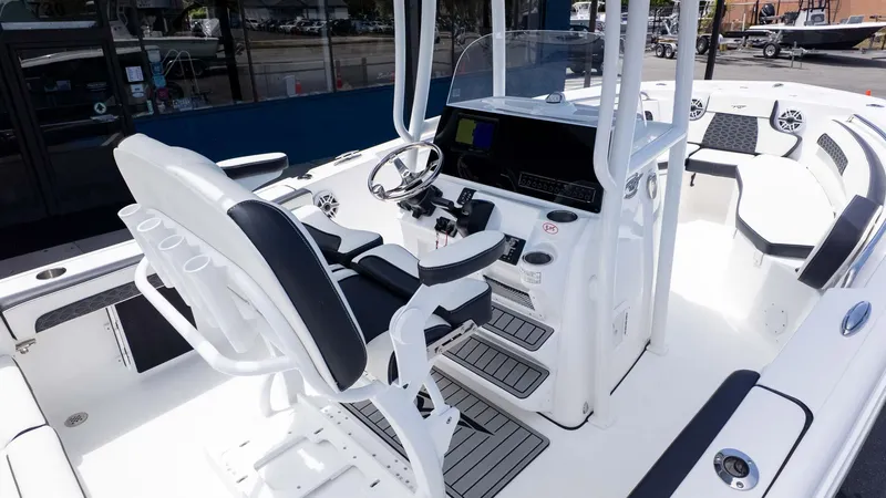 Slide: The Image of 2025 Tidewater 220LXF boat interior with modern helm, seating, and sleek design. - 10