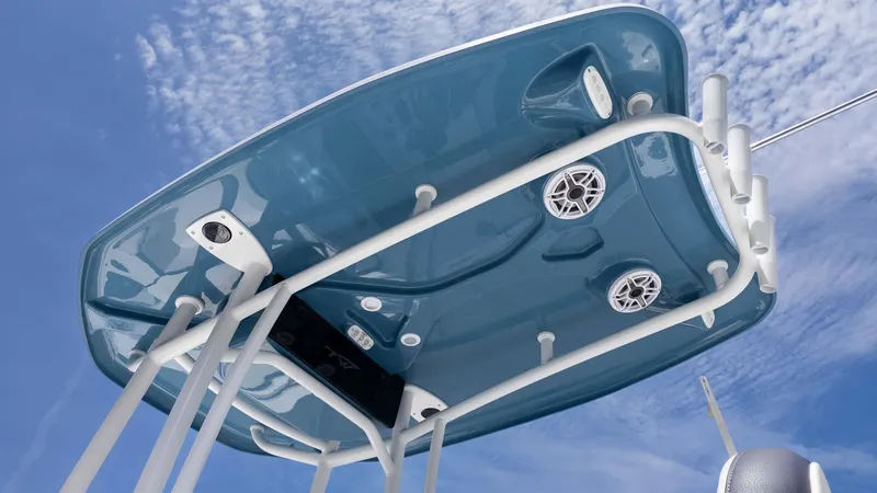 Slide: The Image of 2025 Tidewater 220LXF boat canopy with speakers and lights against a blue sky. - 13