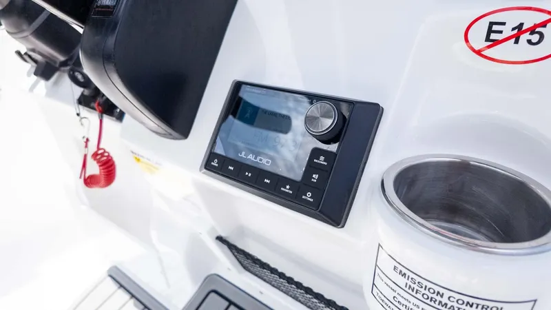 Slide: The Image of Control panel of 2025 Tidewater 220LXF boat featuring JL Audio system. - 16