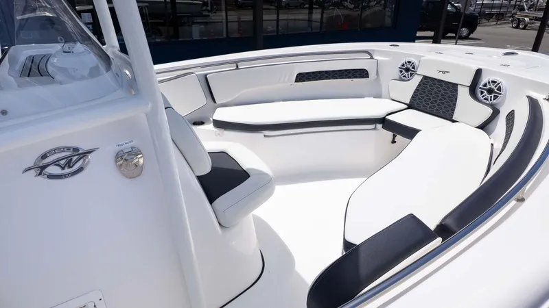 Slide: The Image of 2025 Tidewater 220LXF boat interior with cushioned seating and modern design. - 17