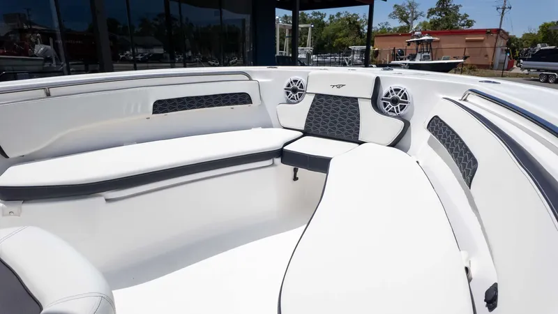 Slide: The Image of 2025 Tidewater 220LXF boat interior with white seating and stylish design. - 19