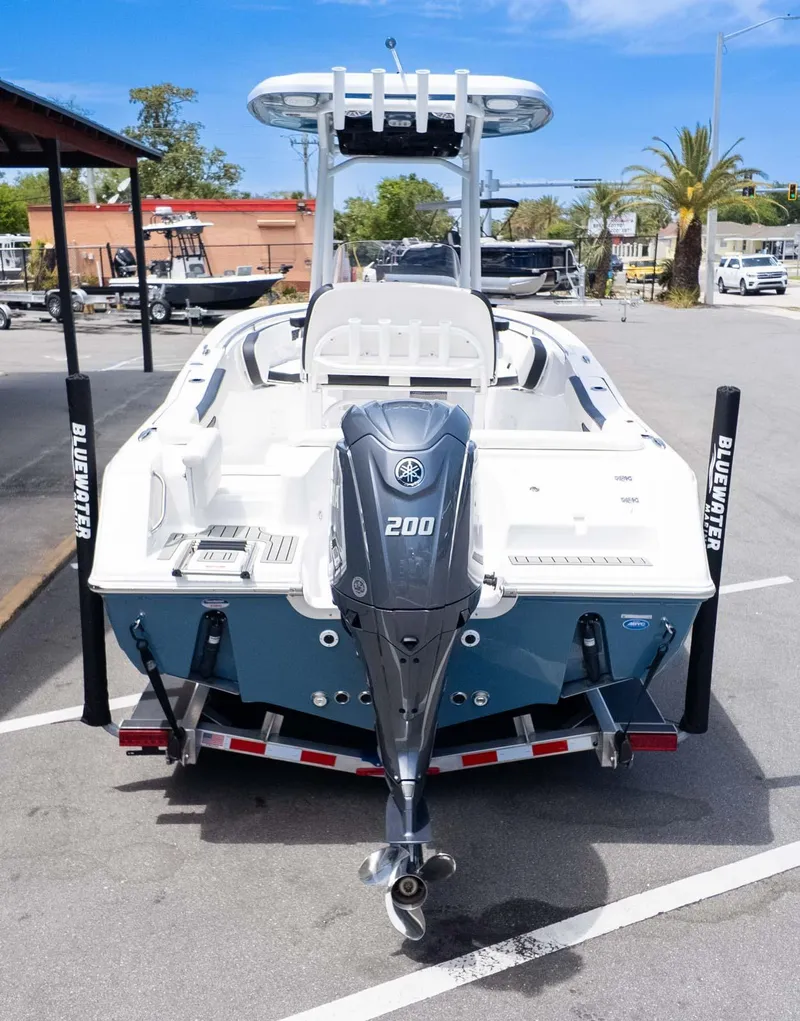 Slide: The Image of 2025 Tidewater 220LXF boat with Yamaha 200 engine, parked on a trailer. - 4