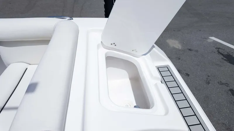 Slide: The Image of Open storage compartment on 2025 Tidewater 220LXF boat deck. - 7