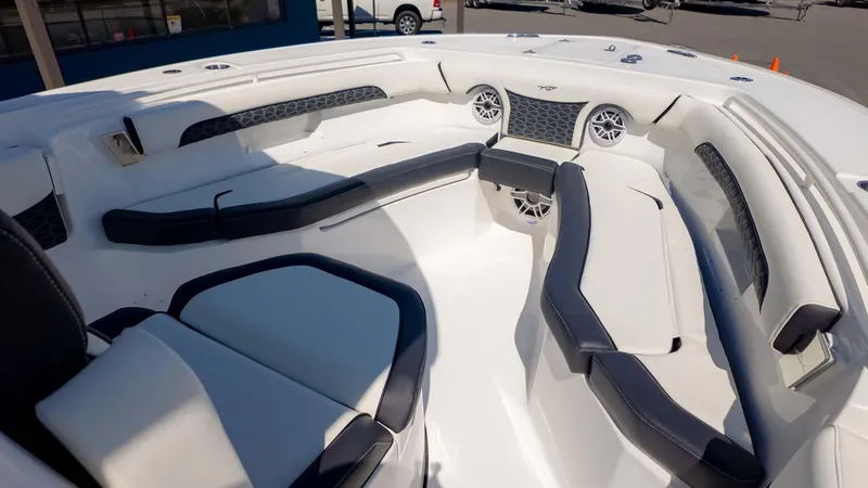Slide: The Image of 2025 Tidewater 256CC boat interior with spacious seating and modern design. - 19