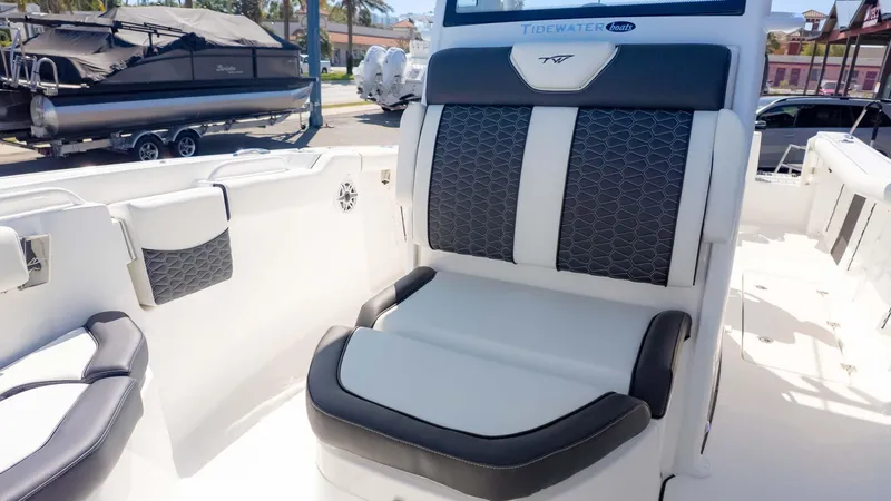 Slide: The Image of 2025 Tidewater 256CC boat interior with stylish seating and modern design. - 21