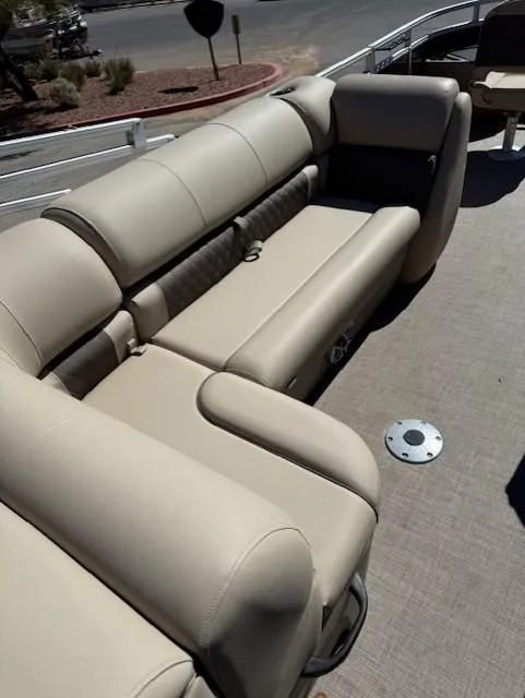 Slide: The Image of 2025 Sun Tracker Fishin' Barge 20 DLX, beige seating, spacious deck, outdoor leisure. - 10