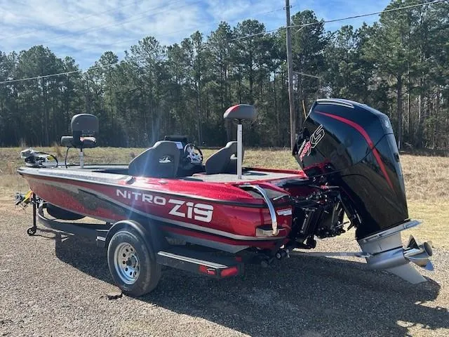 Slide: The Image of 2025 Nitro Z19 boat with powerful engine, parked outdoors on a sunny day. - 4