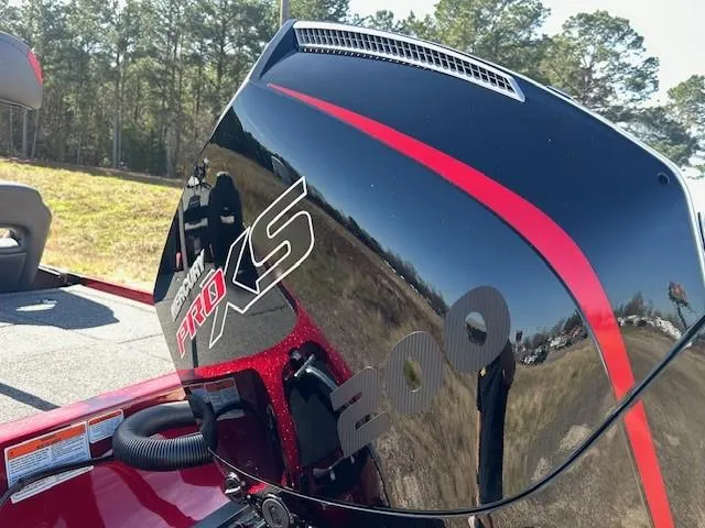 Slide: The Image of 2025 Nitro Z19 boat with Mercury Pro XS 200 engine, outdoors. - 8