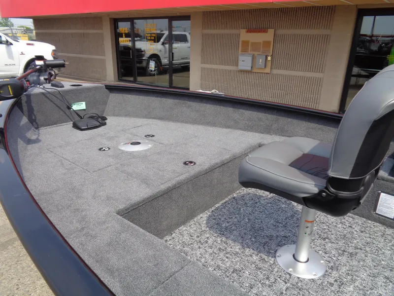 Slide: The Image of 2025 Tracker Super Guide V-16 T boat interior with seating and carpeted deck. - 10