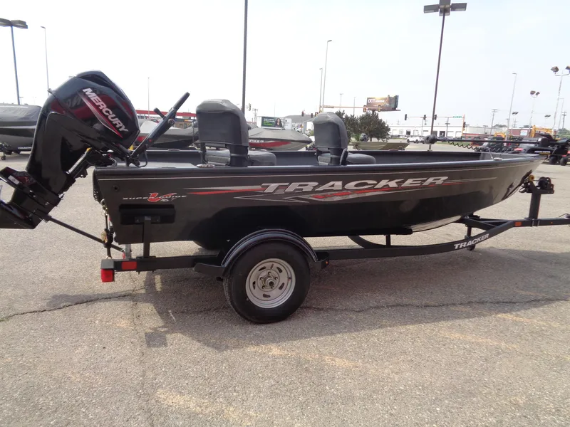 Slide: The Image of 2025 Tracker Super Guide V-16 T fishing boat on trailer, parked outdoors. - 3
