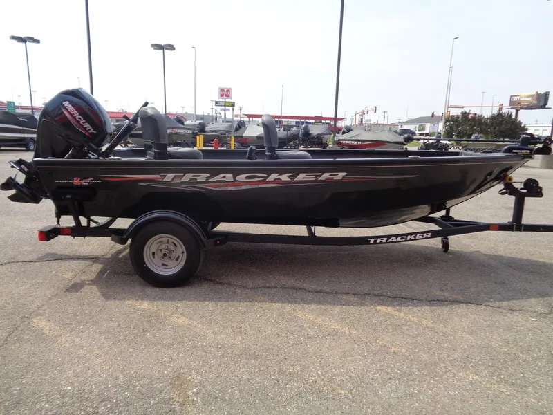 Slide: The Image of 2025 Tracker Super Guide V-16 T boat on trailer in parking lot. - 4
