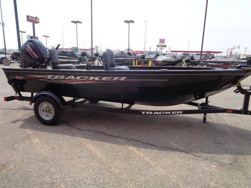Slide: The Image of 2025 Tracker Super Guide V-16 T boat on trailer in parking lot. - 5