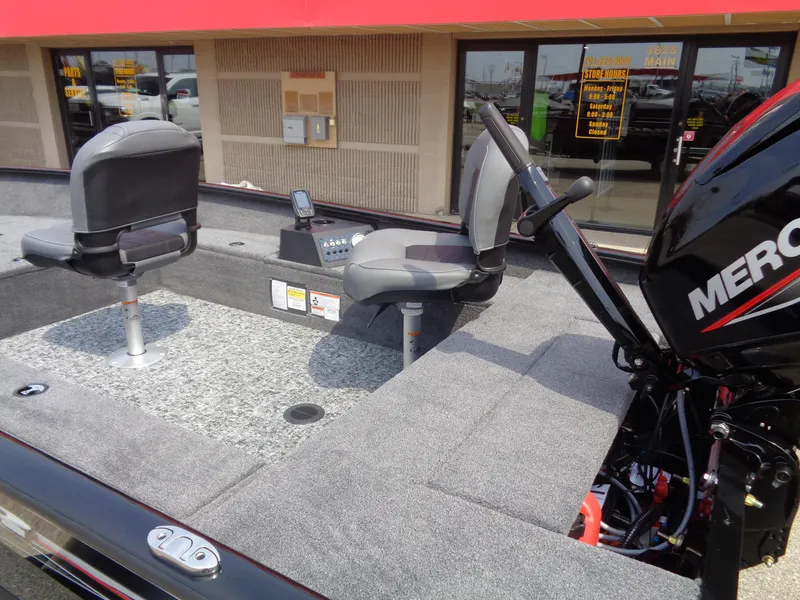 Slide: The Image of 2025 Tracker Super Guide V-16 T boat interior with seating and Mercury engine. - 7