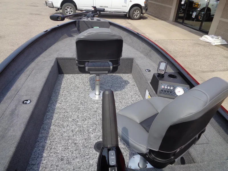 Slide: The Image of 2025 Tracker Super Guide V-16 T boat interior with seating and control panel. - 8