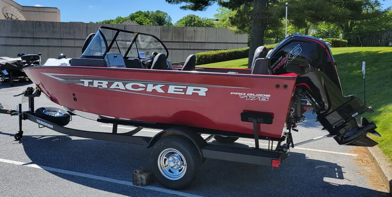 Slide: The Image of 2025 Tracker Pro Guide V-175 Combo boat on trailer in parking lot. - 3