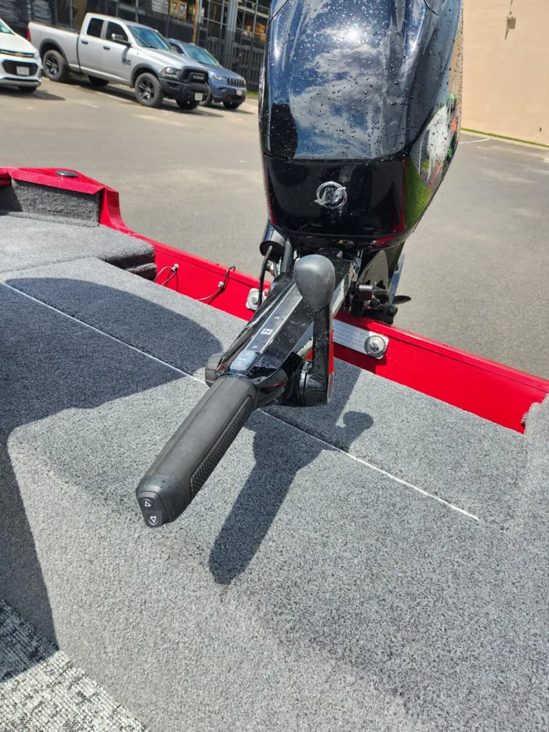 Slide: The Image of 2025 Tracker Super Guide V-16 T boat with motor and steering handle. - 3