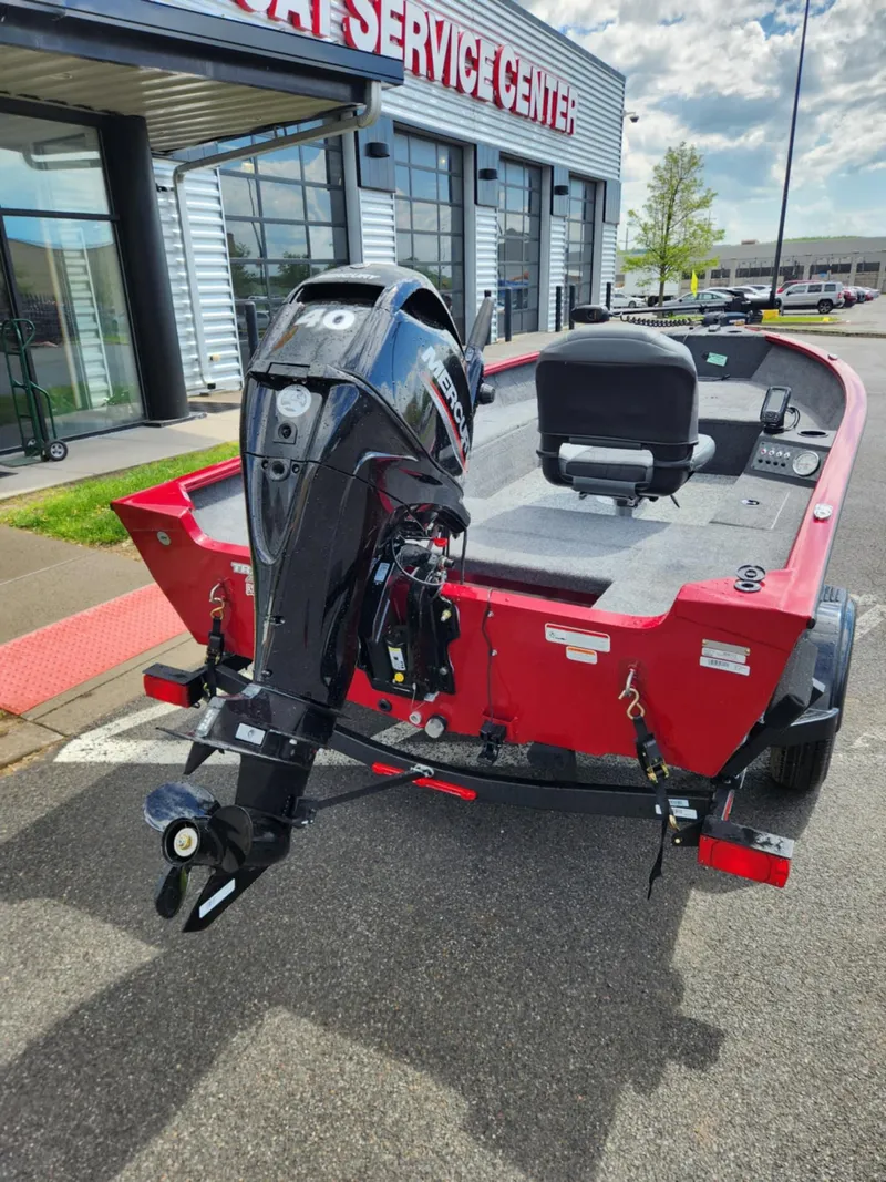 Slide: The Image of 2025 Tracker Super Guide V-16 T boat with outboard motor at service center. - 4
