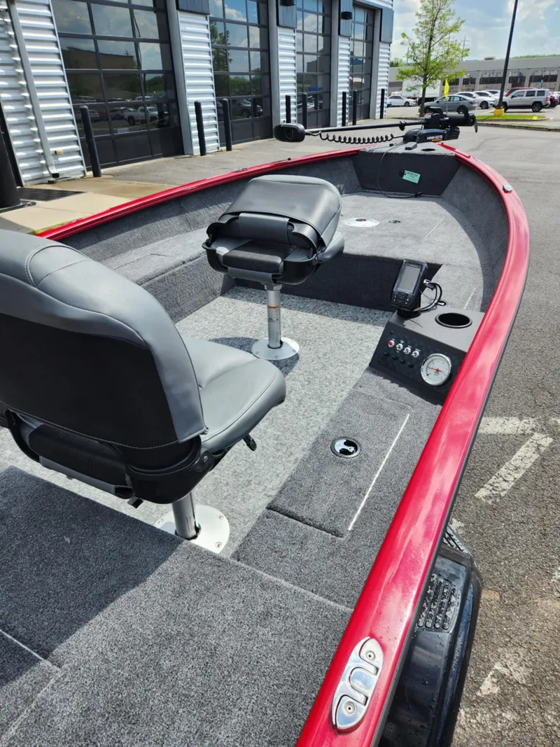 Slide: The Image of 2025 Tracker Super Guide V-16 T boat with red trim and dual seating. - 5